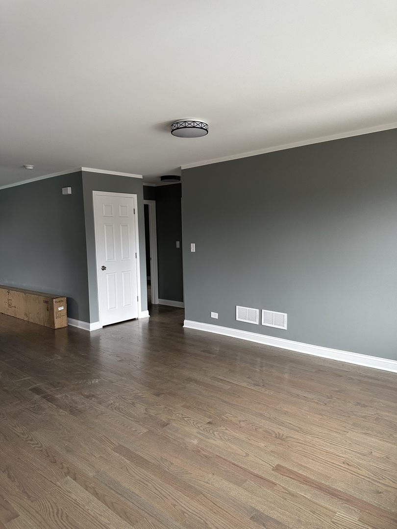 1815 171st Street Hazel Crest, IL 60429 - Photo 11 of 18 a view of an empty room with wooden floor