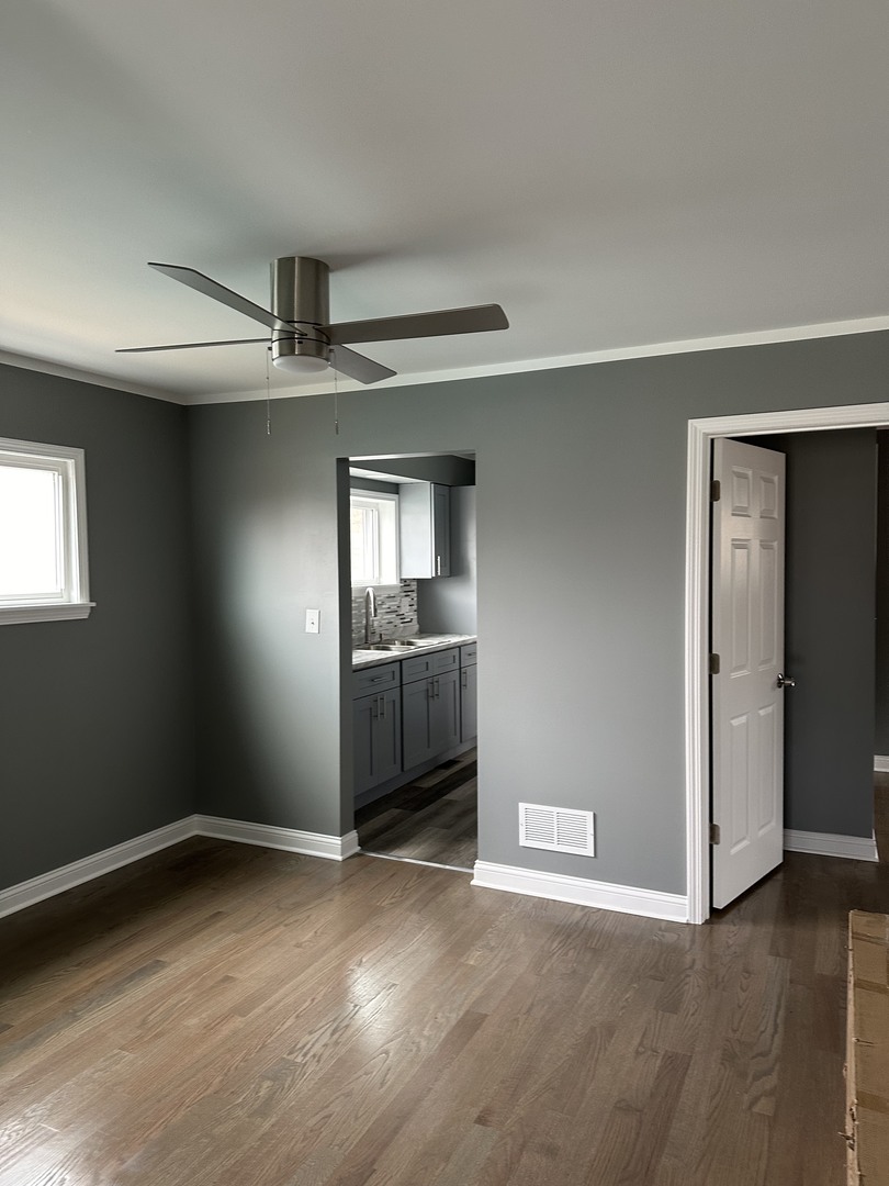 1815 171st Street Hazel Crest, IL 60429 - Photo 12 of 18 a view of wooden floor and windows in a room