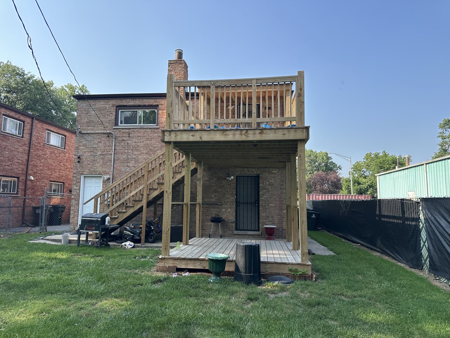 1815 171st Street Hazel Crest, IL 60429 - Photo 14 of 18 a view of a house with a yard and deck