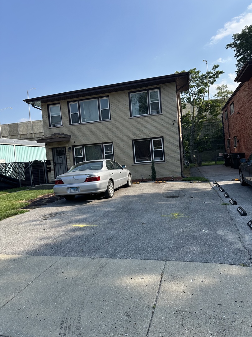 1815 171st Street Hazel Crest, IL 60429 - Photo 2 of 18 a car parked in front of house