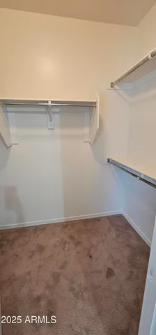 a view of a room with shelf on the wall