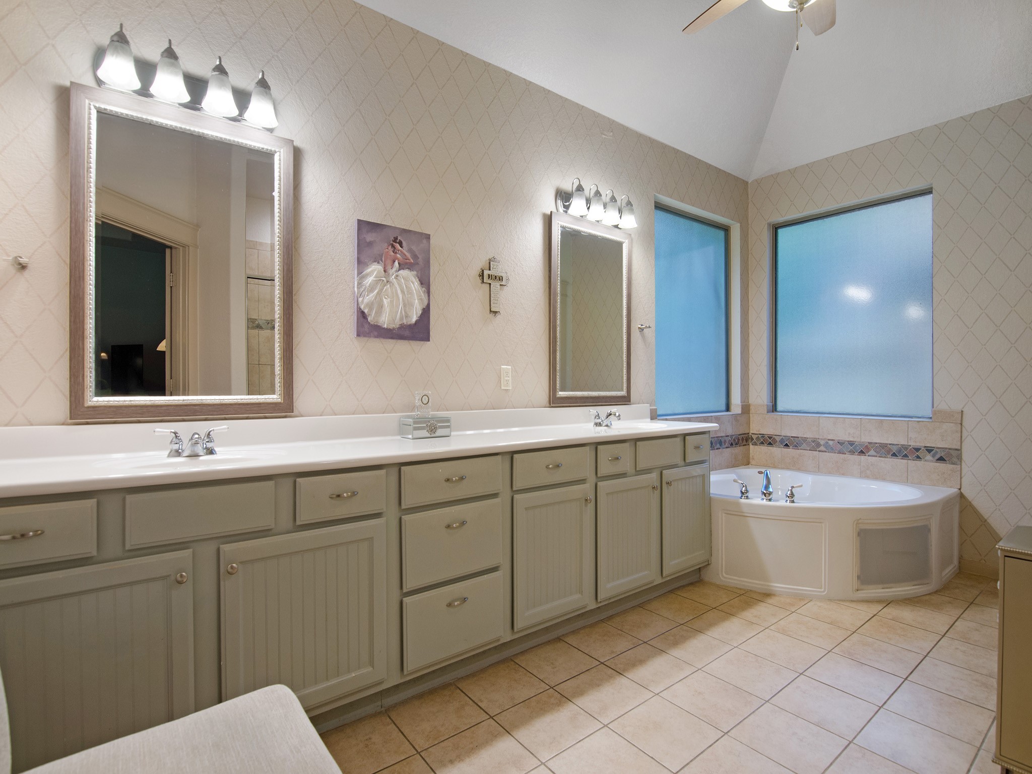 28323 Ryans Ridge Lane Spring, TX 77386 - Photo 20 of 45 Bright and airy primary bath with relaxing garden tub and two oversized privacy windows and vaulted ceiling.