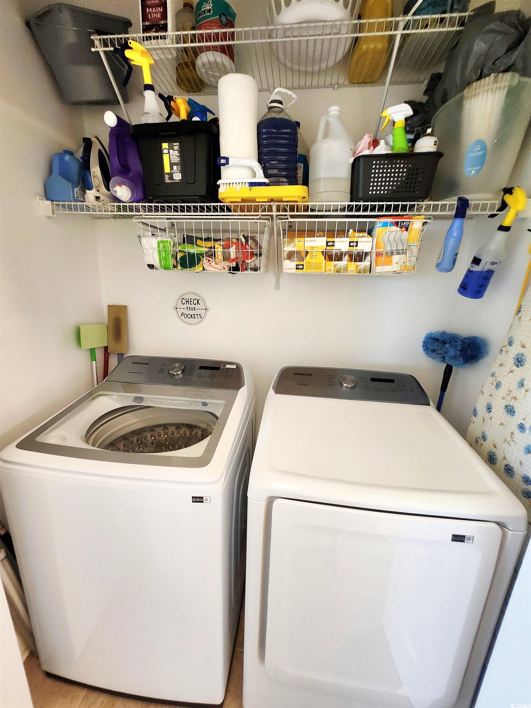 4877 Magnolia Pointe Lane, Unit 201 Myrtle Beach, SC 29577 - Photo 12 of 22 Laundry room featuring washing machine and dryer
