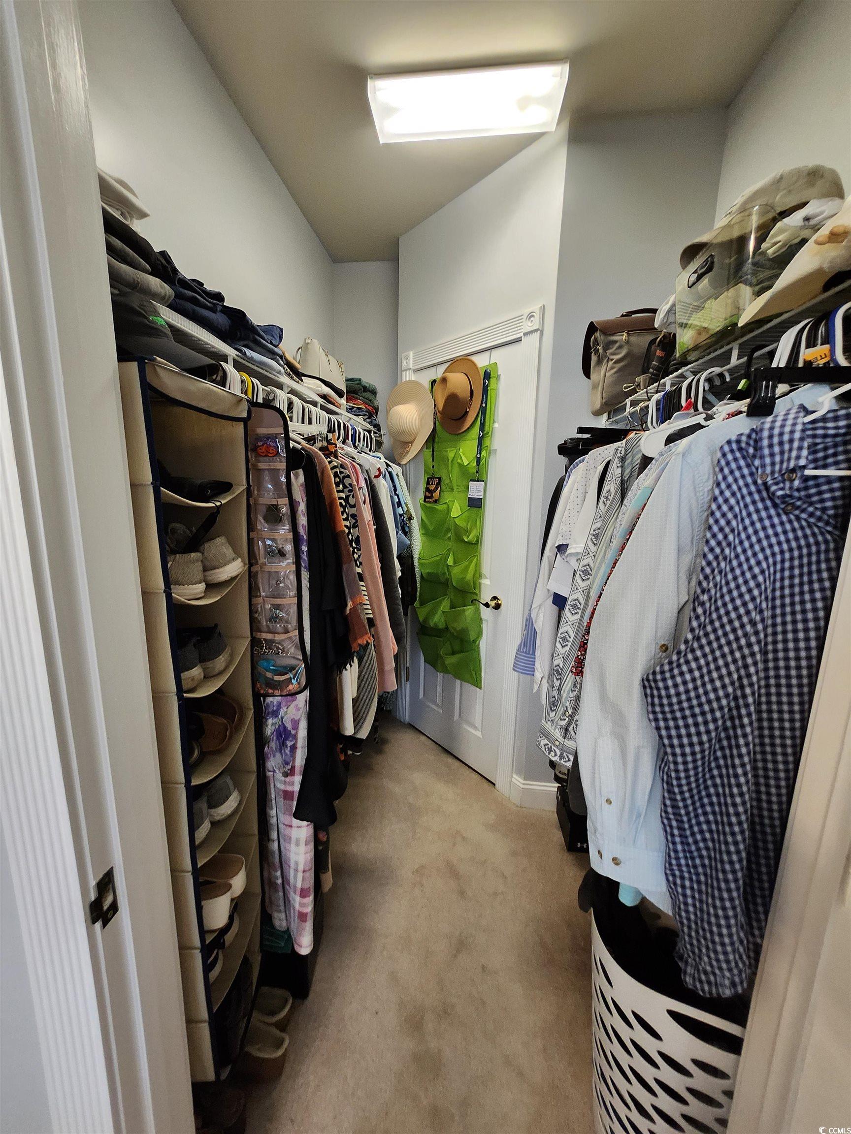 4877 Magnolia Pointe Lane, Unit 201 Myrtle Beach, SC 29577 - Photo 17 of 22 Spacious closet featuring light colored carpet
