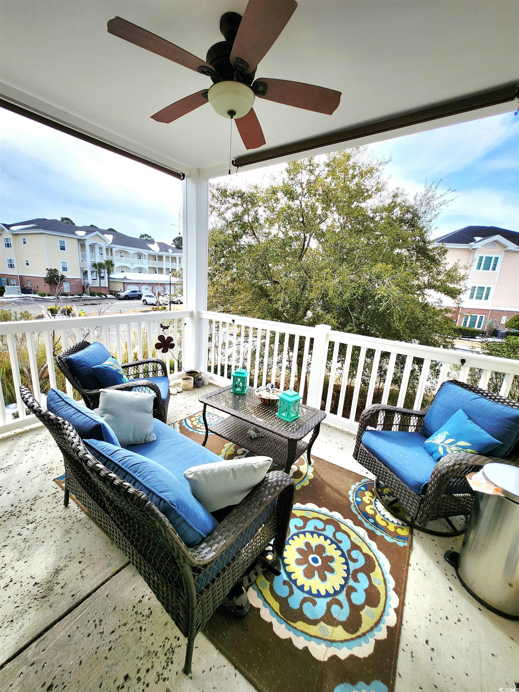 4877 Magnolia Pointe Lane, Unit 201 Myrtle Beach, SC 29577 - Photo 21 of 22 View of patio with an outdoor living space and ceiling fan