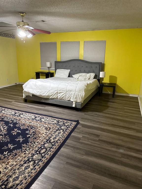 353 Swindle Road Howe, TX 75459 - Photo 2 of 2 Bedroom with dark wood finished floors, a textured ceiling, and ceiling fan