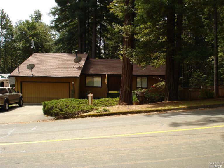2509-2525 Goose Road Willits, CA 95490 - Photo 1 of 1 a front view of a house with a garden