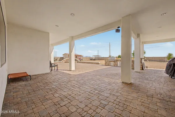 a view of a kitchen with kitchen island and natural light