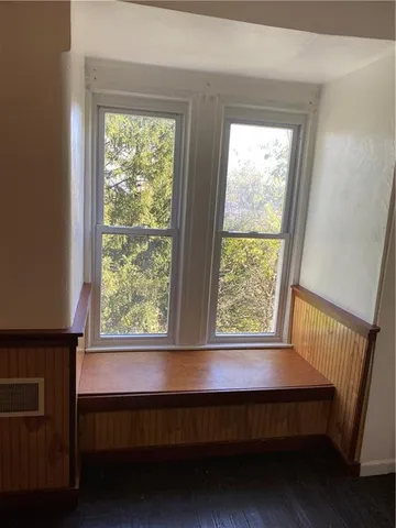 a view of room with furniture and a window