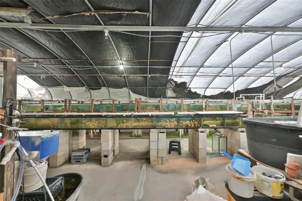 14451 Highland Road Wimauma, FL 33598 - Photo 24 of 80 a view of a storage room with racks