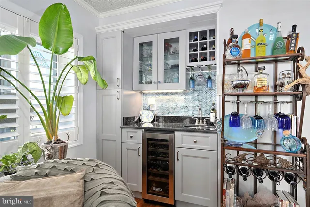 a kitchen with stainless steel appliances granite countertop a stove and a dining table