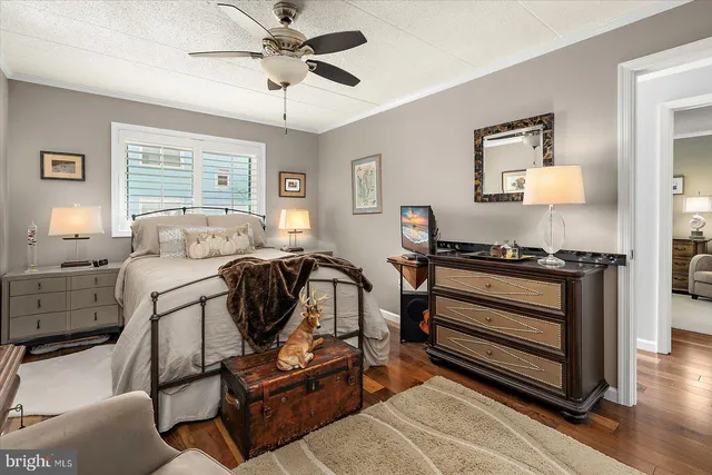 a bedroom with furniture and a window