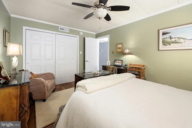 a bedroom with a bed couch and window