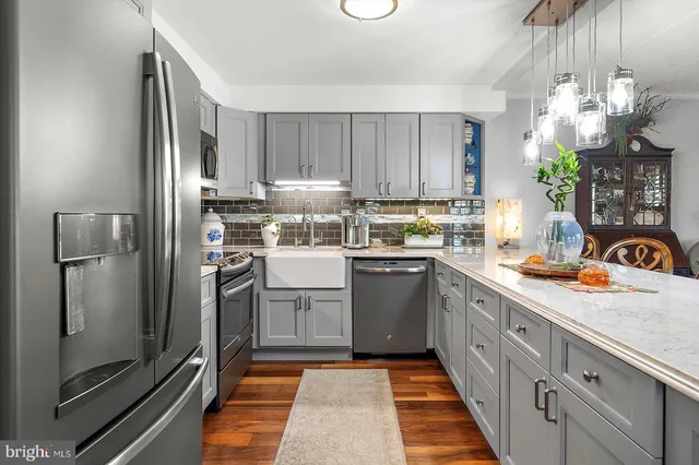 a kitchen with sink cabinets and outdoor view