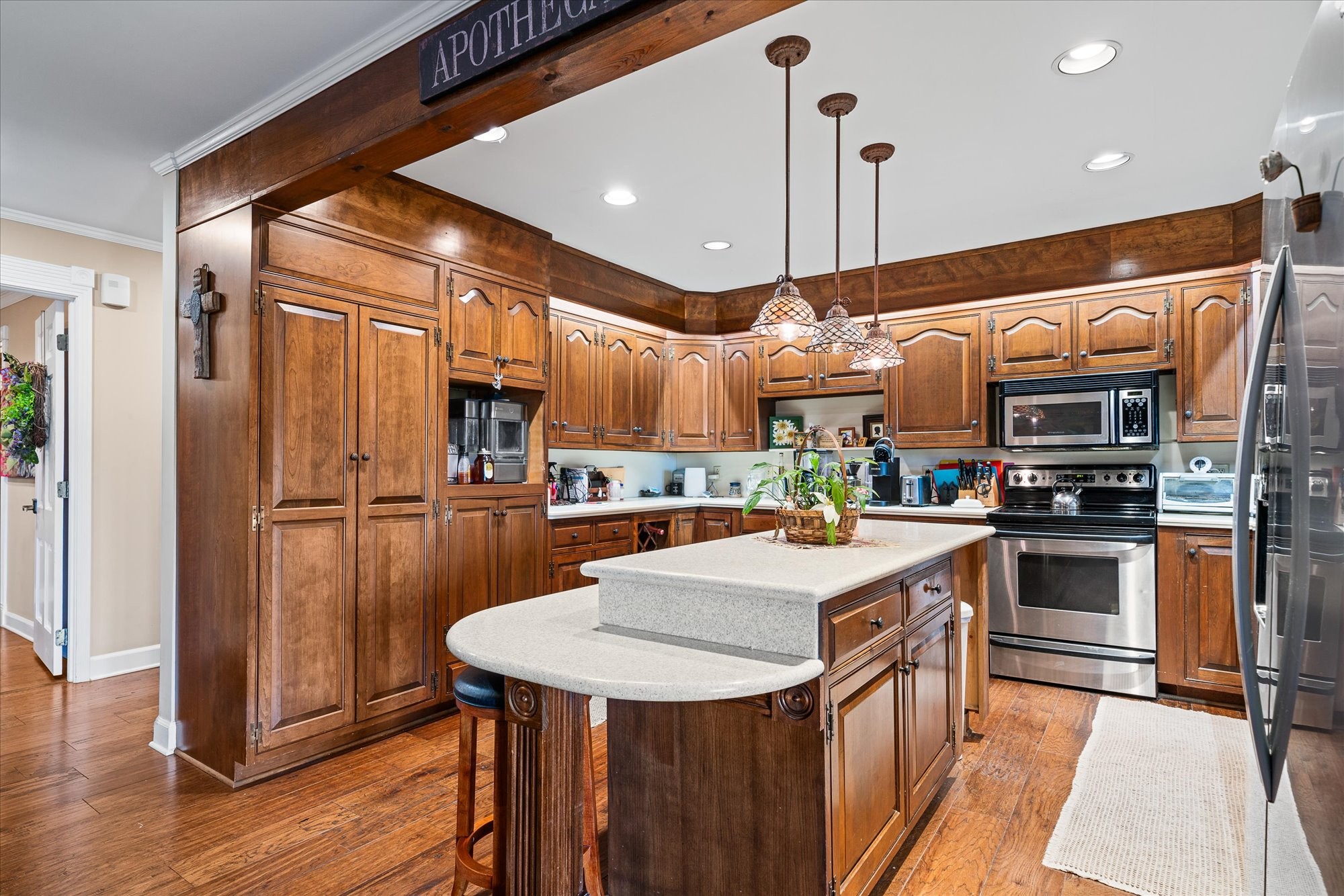 548 Turntable Road Sparta, TN 38583 - Photo 11 of 51 a kitchen with stainless steel appliances a refrigerator a stove a sink and a dining table with wooden floor