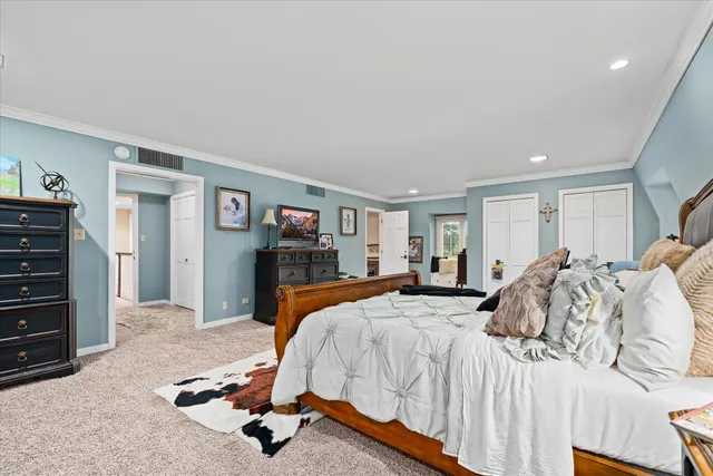 a bed room with a bed and a television