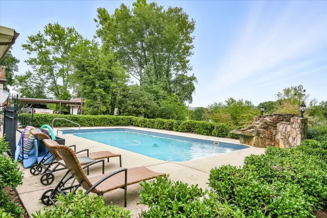 a view of a swimming pool with a patio