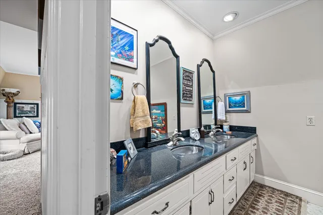 a bathroom with a double vanity sink and a mirror