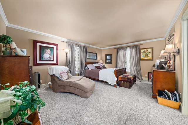 a bedroom with furniture and a window