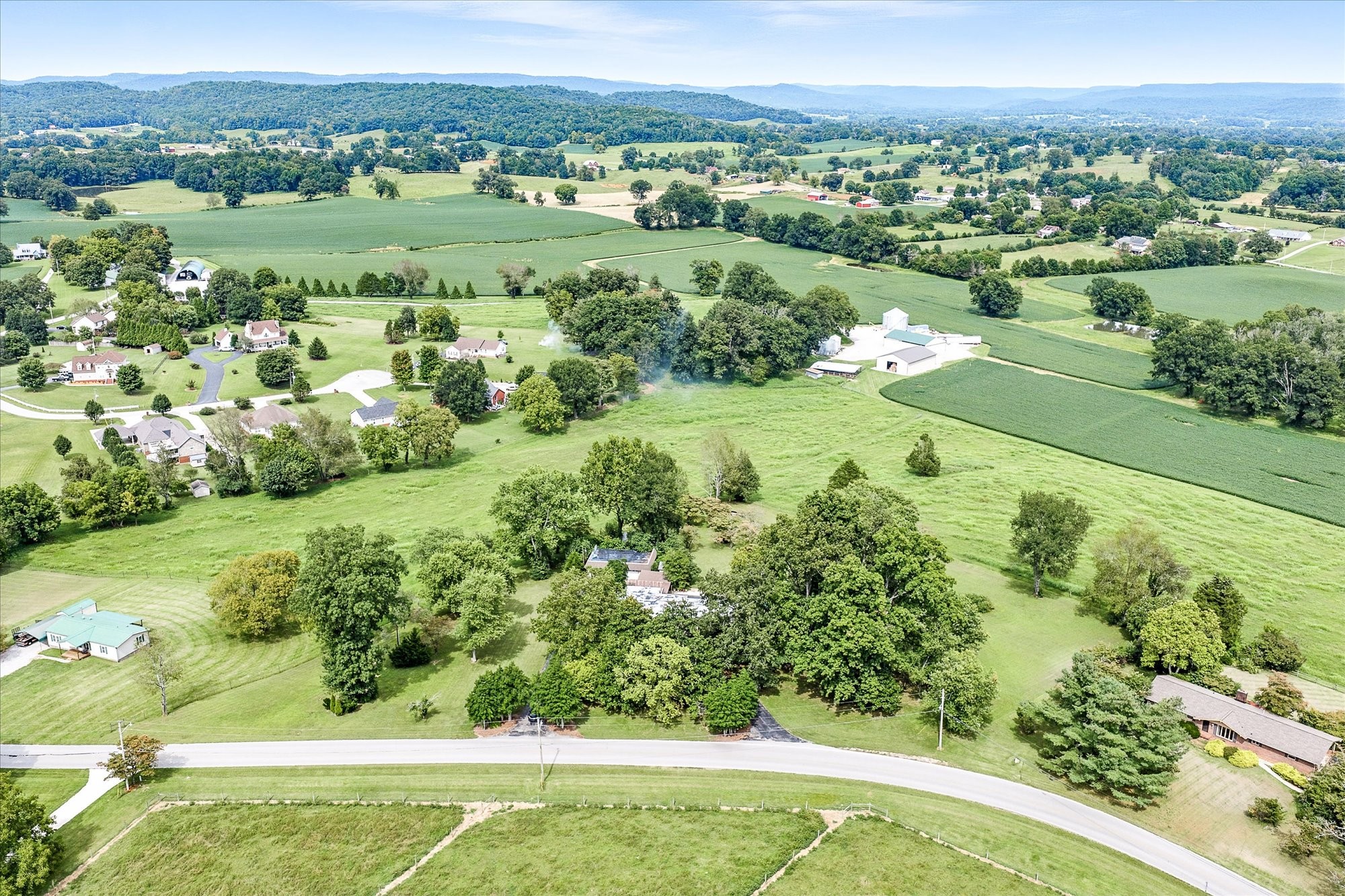 548 Turntable Road Sparta, TN 38583 - Photo 35 of 51 an aerial view of green landscape with trees houses and trees