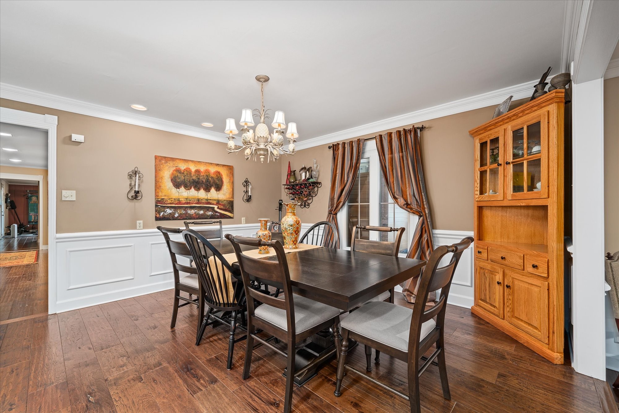 548 Turntable Road Sparta, TN 38583 - Photo 10 of 51 a view of a dining room with furniture a chandelier and wooden floor