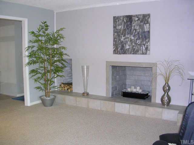 3500 Neptune Drive Raleigh, NC 27604 - Photo 5 of 10 Large living room with masonry fireplace and raised hearth