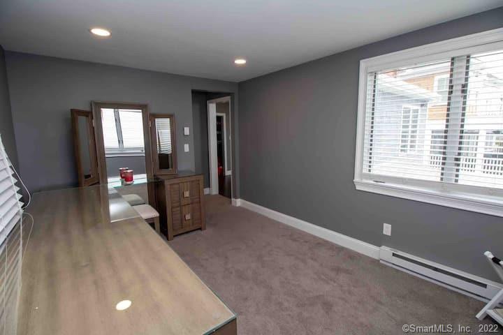 21 Grove Way, Unit 21 Clinton, CT 06413 - Photo 17 of 37 a living room with furniture and a flat screen tv