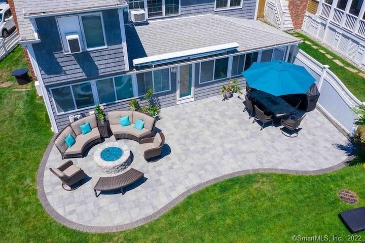 21 Grove Way, Unit 21 Clinton, CT 06413 - Photo 22 of 37 a backyard of a house with yard and outdoor seating