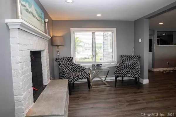a view of a livingroom with furniture and wooden floor
