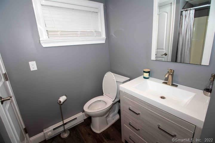 21 Grove Way, Unit 21 Clinton, CT 06413 - Photo 34 of 37 a bathroom with a toilet sink and mirror