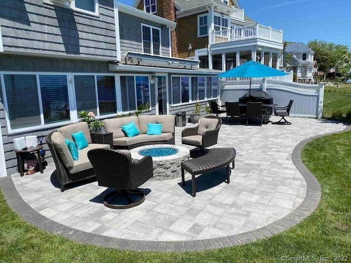 21 Grove Way, Unit 21 Clinton, CT 06413 - Photo 4 of 37 a building outdoor space with patio furniture and garden