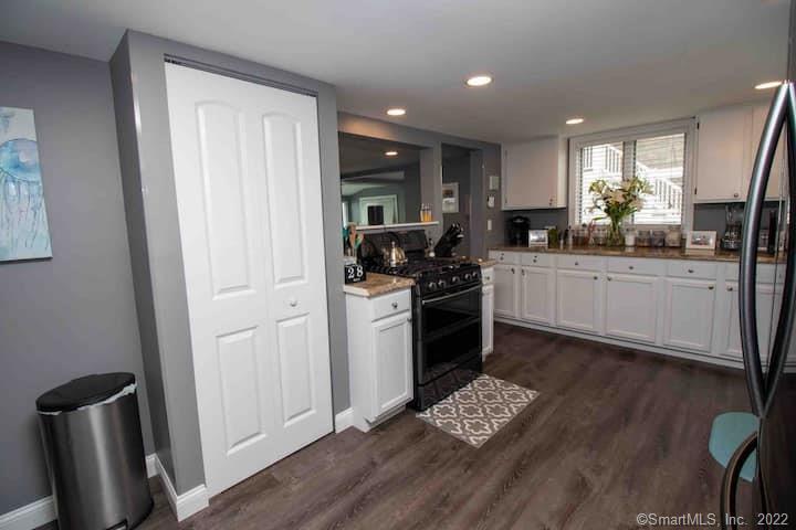 21 Grove Way, Unit 21 Clinton, CT 06413 - Photo 5 of 37 a kitchen with stainless steel appliances granite countertop a refrigerator sink and stove