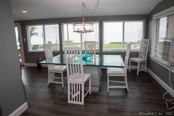 a dining room with furniture window wooden floor