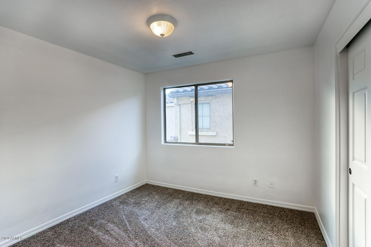 1958 West Davis Road Phoenix, AZ 85023 - Photo 16 of 25 an empty room with a window