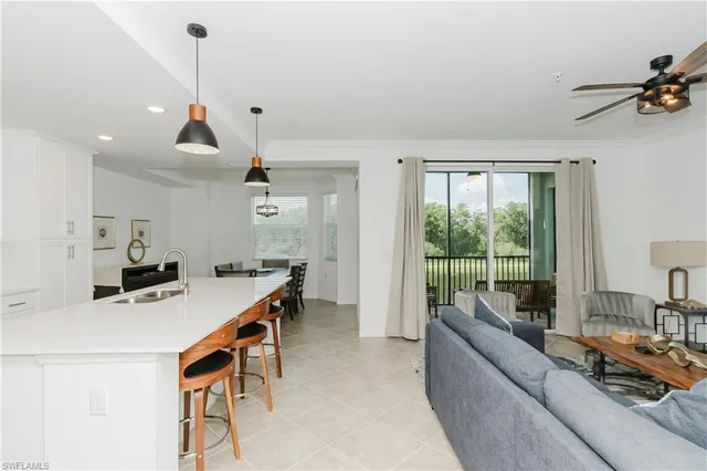 a kitchen with a sink and a refrigerator
