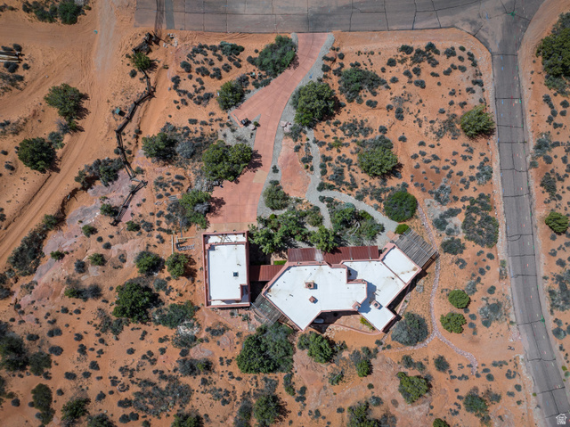 3617 Red Rock Drive Moab, UT 84532 - Photo 69 of 79 Aerial view of property and surrounding area featuring a desert landscape and rural landscape