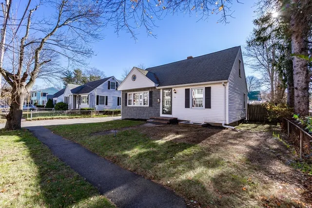 a view of house with yard