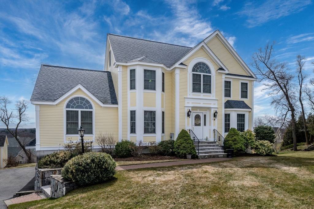 9 Kettle Way Dracut, MA 01826 - Photo 1 of 19 a front view of a house with garden