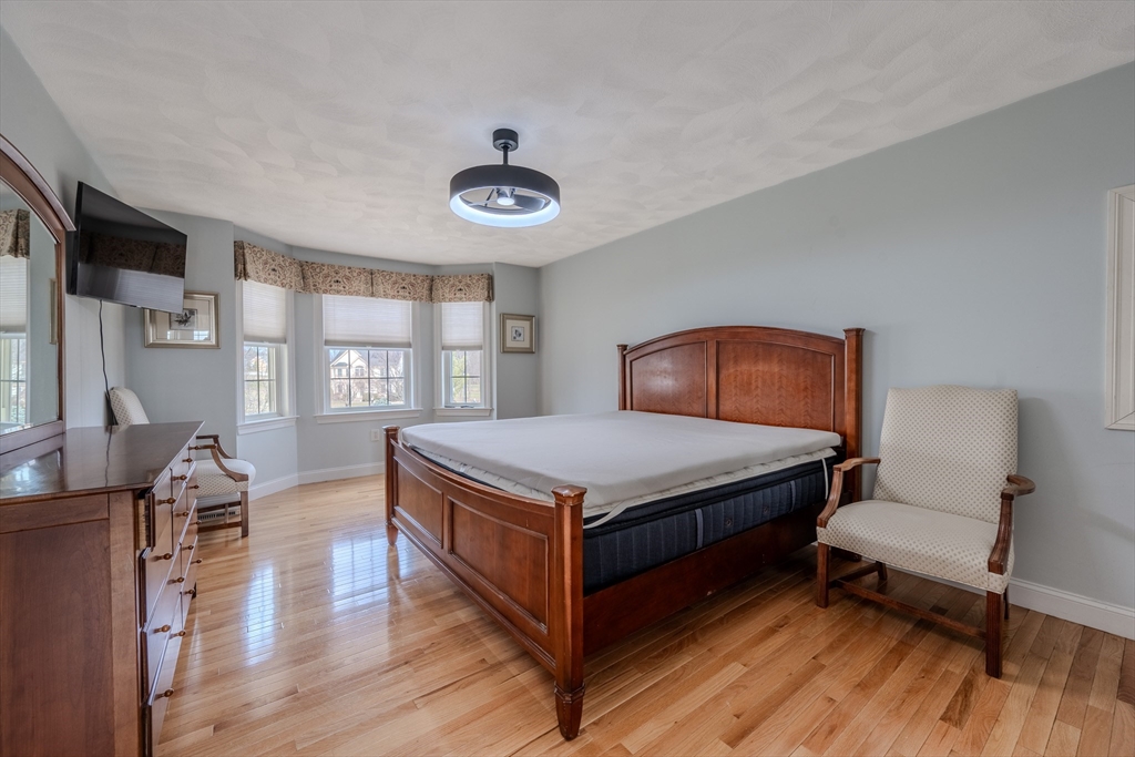 9 Kettle Way Dracut, MA 01826 - Photo 14 of 19 a bedroom with a bed and a large window