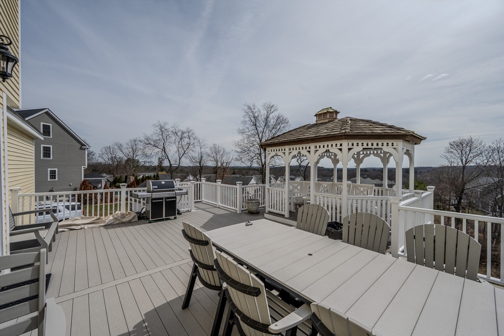 9 Kettle Way Dracut, MA 01826 - Photo 19 of 19 a roof deck with a table and chairs