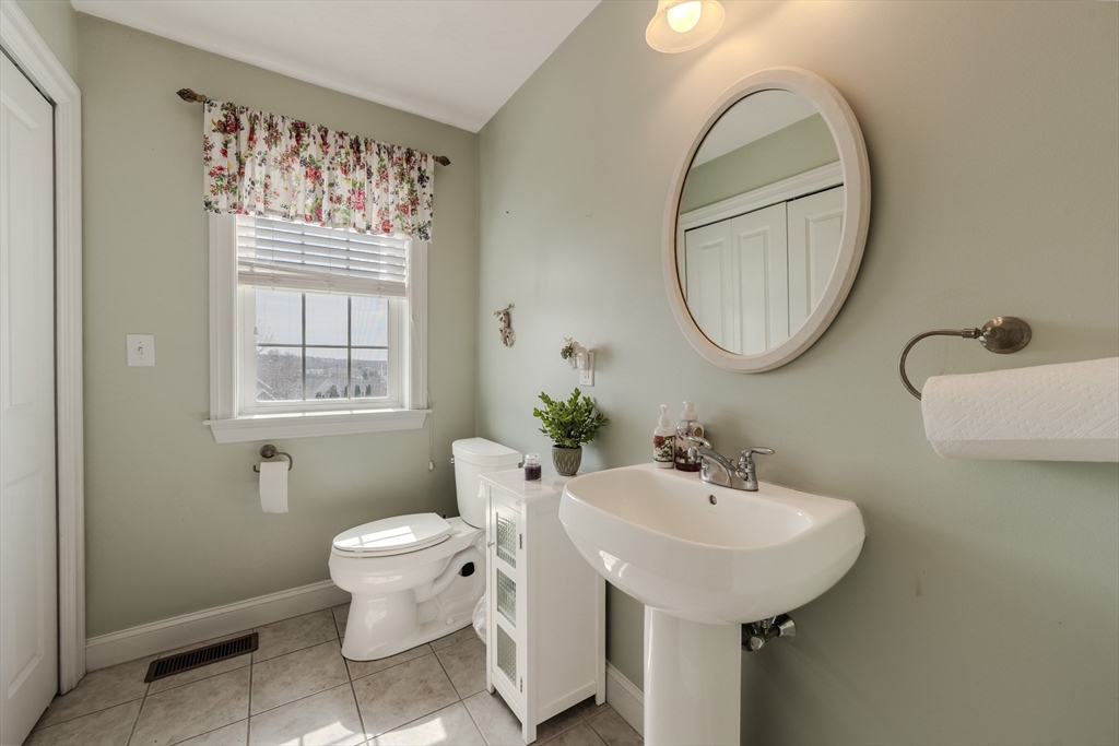 9 Kettle Way Dracut, MA 01826 - Photo 6 of 19 a bathroom with a toilet sink and mirror