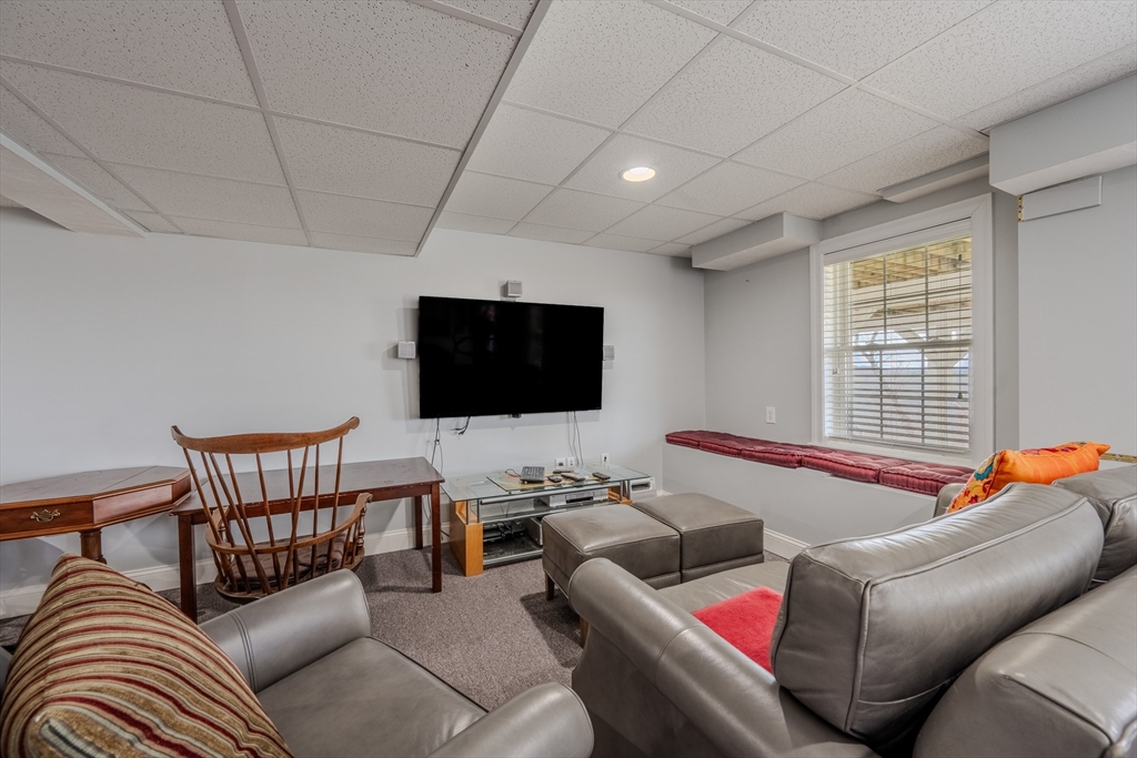 9 Kettle Way Dracut, MA 01826 - Photo 10 of 19 a living room with furniture and a flat screen tv