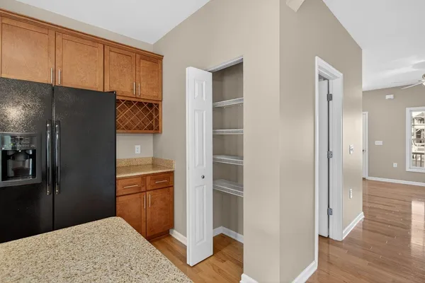 a view of a room with wooden floor and staircase