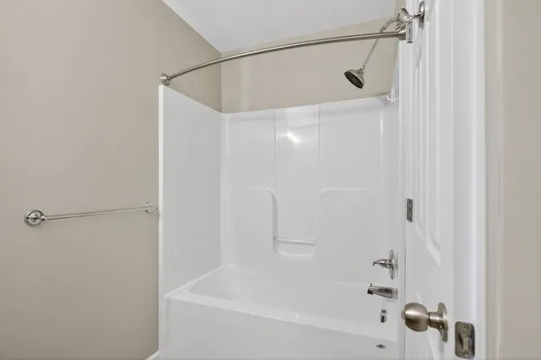 a view of a bathroom from a hallway