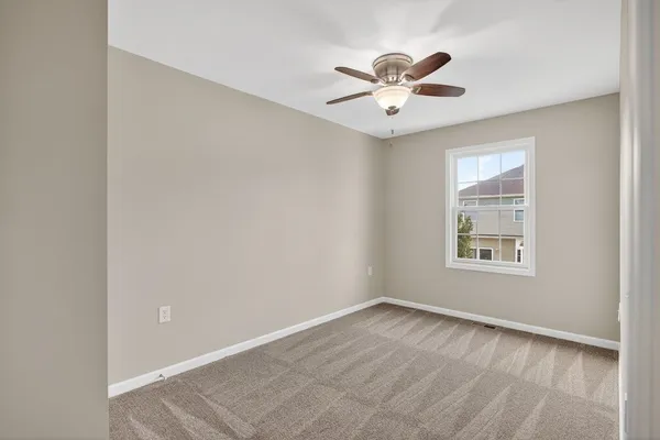 a bathroom with a sink vanity and a toilet