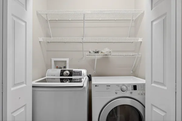 a front view of a house with a yard and outdoor seating