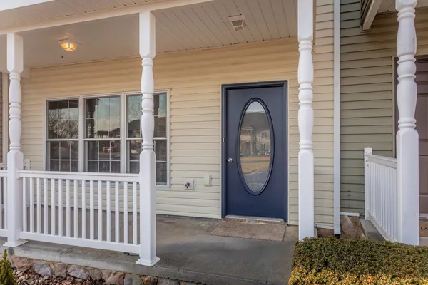 a view of a house with a door and a window