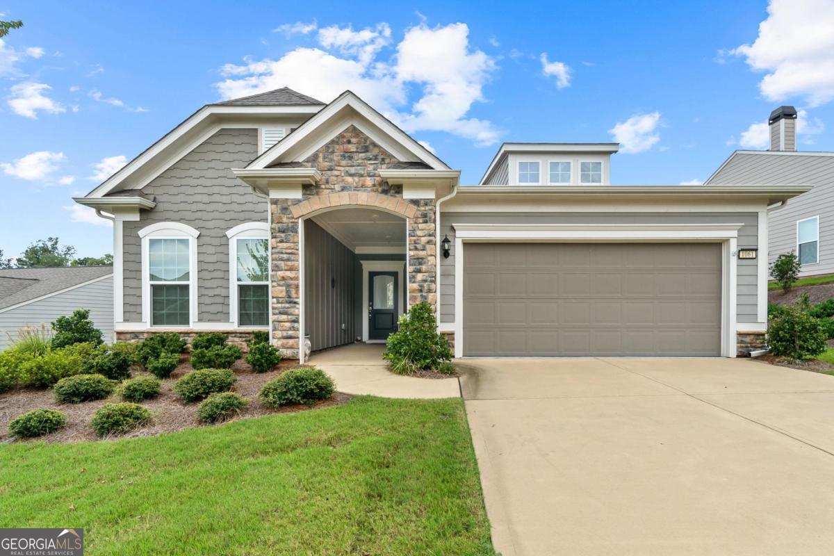 front view of a house with a yard