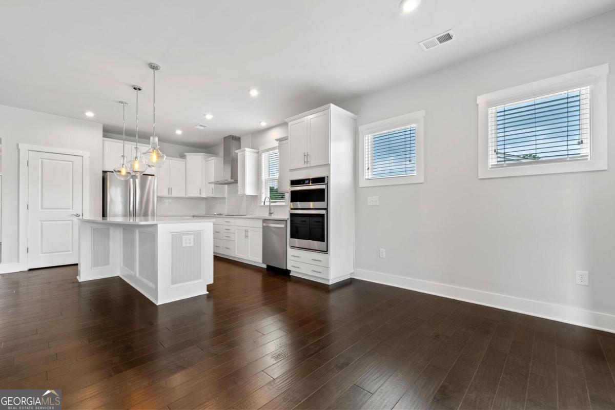 1061 Little Shls Road Greensboro, GA 30642 - Photo 12 of 41 a view of kitchen with stainless steel appliances refrigerator oven and cabinets