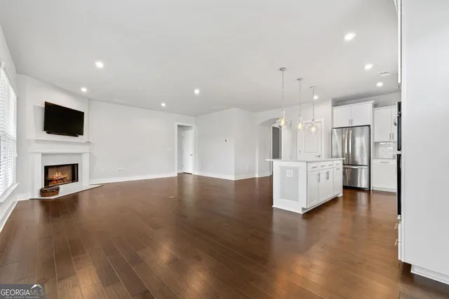 a view of a kitchen with furniture and a fireplace